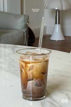 an iced drink with ice sits on a table