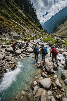 group of hikers crossing stream in alpine area with rocks and grass on both sides