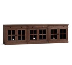 the sideboard is made from wood and has glass doors on one side, and two drawers on the other