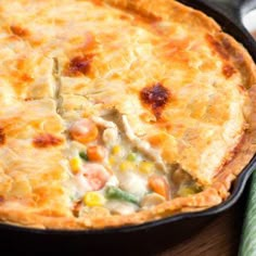 a close up of a pie in a pan on a table