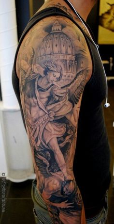 a man with a very large tattoo on his arm