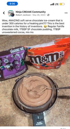 an image of some kind of chocolate cream in a bowl on the counter with other items