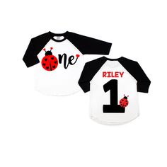 two white and black shirts with ladybug numbers on the front, one is 1