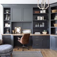 a home office with gray cabinets and chairs