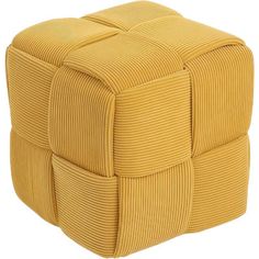 a yellow cube shaped ottoman sitting on top of a white floor