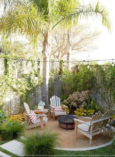 an outdoor patio with chairs and trees in the background