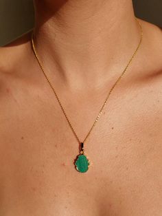 "Green Malachite Hamsa Pendant Necklace, Dainty Gold Malachite Necklace DETAILS    - 14K Gold Filled Chain - 14K Gold Filled Spring Ring Clasp 5mm - 14K Gold Filled 2 inches Extender Chain  - Gold Plated Malachite Pendant 12 x 22 mm   Select your preferred necklace length from the drop-down menu. The model is wearing a length of 16\" Please note: Because we use natural stones, the stones may vary slightly in shape, shade, and size. They may also contain natural inclusions. If you have any questions, please feel free to contact me.    This malachite necklace is made with a hamsa pendant to create gorgeous women's jewelry. It closes with a 14K gold-filled spring-ring clasp. This dainty green malachite necklace looks gorgeous on its own or stacked with other pieces. Lovely women's jewelry gif Green Locket Necklace With Round Pendant, Green Amulet Pendant Necklace, Green Amulet Pendant Jewelry, Green Gemstone Pendant Charm Necklace, Green Oval Pendant Amulet Necklace, Green Teardrop Pendant Spiritual Jewelry, Green Spiritual Teardrop Pendant Jewelry, Green Amulet Jewelry With Natural Stones, Spiritual Green Teardrop Pendant Jewelry