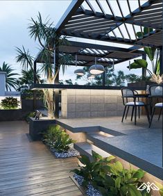 an outdoor dining area with plants and lights