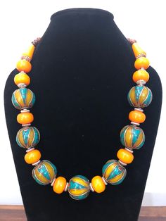 Beautiful Amber Necklace! Beautifully crafted amber necklace, with turquoise work on top of the beads. Awesome necklace, can be worn on very especial occasion. Amber Beaded Necklace With Large Beads As Gift, Artisan Amber Necklaces With Large Beads, Amber Beaded Necklaces With Large Beads For Gifts, Unique Orange Necklace With Polished Beads, Traditional Yellow Gemstone Beads Necklace, Orange Spiritual Necklace With Colorful Beads, Unique Amber Beaded Necklaces With Colorful Beads, Unique Amber Beaded Necklace With Colorful Beads, Amber Beaded Necklaces With Spacer Beads As Gift