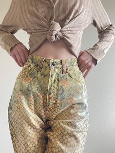 "Extremely Rare 90s Roberto Cavalli pineapple print jeans. Flattering shape, high waist, straight leg. Size small Waist 25\" hips 35\" inseam 30\" rise 11\" Very good vintage condition. For the reference: model 5'8\", size xs 30\"A/25\"/35\" *all items will be washed/cleaned before shipping. *some items may come with minor flaws due to vintage pre-loved condition. All major flaws will be described and photographed. *tag us on Instagram (@alizee_vintage) wearing your special garments from Alizee Vintage Printed Bottoms For Spring, Printed Straight Leg Jeans For Spring, 90s Style Tapered Leg Spring Bottoms, Straight Leg Cotton Printed Jeans, Vintage Fitted Printed Bottoms, Vintage Tapered Leg Jeans For Summer, Vintage High-waisted Relaxed Fit Jeans, Fitted High Waist Yellow Jeans, High Waist Yellow Denim Jeans