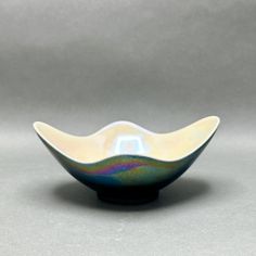 a white and blue bowl sitting on top of a table