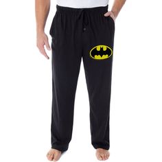 This classic Batman lounge pant is an officially licensed DC Comics product! If you're a fan of DC Comics and Justice League superheroes, you're going to love this Batman merchandise! Batman is one of the most popular comic characters ever! He's known by many names, The Dark Knight, The Caped Crusader, and Batsy to the Joker, his rival. He is a genuinely beloved superhero! These Batman pajama pants feature a high-quality print design of a classic Bat Symbol logo on the left leg! The pants featur Cotton Lounge Pants With Character Print, Batman Pajama Pants, Mens Pyjama Bottoms, Batman Merchandise, Dc Comics Women, Bat Symbol, Caped Crusader, Mens Nightwear, Fleece Pajama Pants