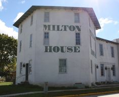 a large white building with the words millon house on it's front and side