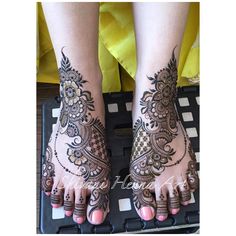 the feet are decorated with henna and flowers