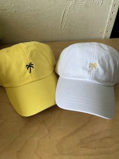 Great for vaca or bach! Lemon colored dad hat embroidered with black polyester thread Comfortable with a cool crown mesh lining on the inside Adjustable on the backside with a brown leather strap One size fits most *Ask about other hat color options Ships in 3-4 business days Brown Leather Strap, Dad Hat, Hat Designs, Palm Tree, Dad Hats, Color Options, Leather Straps, Brown Leather, Baseball Hats