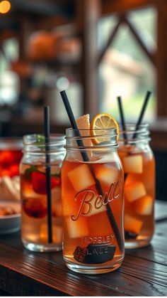 Three mason jars filled with iced tea, garnished with lemon and mint, on a wooden table. Hay Bale Seating, Rustic Signage, Wedding Entrance, Wedding Theme Ideas, Outdoor Setting