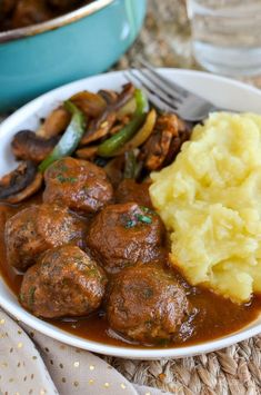 meatballs, mashed potatoes and gravy on a plate