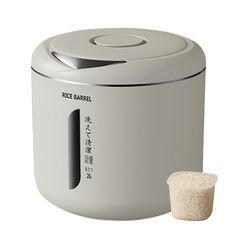 a rice cooker with the lid open next to it