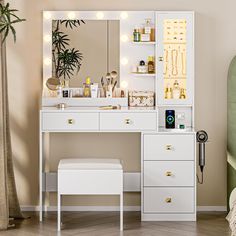 a white dressing table with lights on it