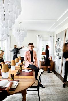 a man sitting at a table in a living room