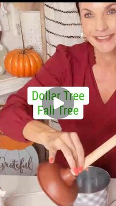 a woman in a red shirt holding a pot and wooden spoon with the words dollar tree fall tree on it