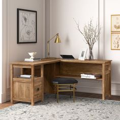 a corner desk with an open drawer underneath it and a chair in front of it