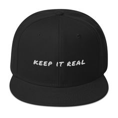 Introducing our sleek Keep It Real Snapback Hat - the perfect accessory for a trendy and laid-back style. This classic baseball cap comes with an adjustable snap closure, ensuring a comfortable fit for all head sizes. Its flat brim adds an urban edge, while the high-quality materials keep you cool and stylish in any setting. Key Characteristics: • 85% acrylic, 15% wool • Structured, 6-panel, high-profile • Plastic snap closure • Grey under visor • Head circumference: 22”–24” Classic Flat Cap Fitted Hat For Streetwear, Classic Streetwear Hat With Flat Crown, Classic Snapback Hat With Flat Crown For Streetwear, Classic Flat Crown Hat For Streetwear, Classic Fitted Hat For Streetwear, Classic Fitted Hat For Streetwear, One Size, Classic Adjustable Baseball Cap With Flat Crown, Classic Snapback Hat For Streetwear, Trendy Adjustable Snapback Baseball Cap