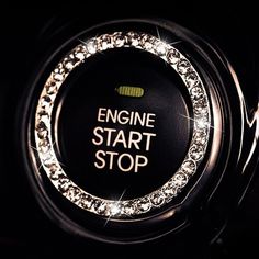 the engine start stop button is decorated with swaroes and sparkles in black