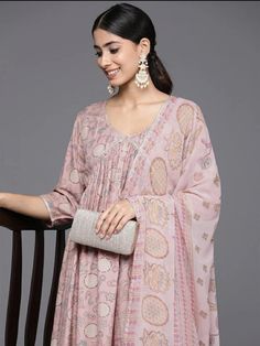 * Women Floral Printed Pleated Gotta Patti Kurta with Trousers & With Dupatta Pakistani Salwar Kameez / Indian Wedding Dress / Plus Size Cotton Dress Traditional Indian Wear / Salwar Kameez Dupatta / Kurti Palazzo Set / Hand Embroidery kurta * Pink printed Kurta with Trousers with dupatta     * Kurta design:-  *  Floral printed   *  A-line shape   *  Pleated style   *  V-neck,  three-quarter regular sleeves   *  2 pockets gotta patti detail   *  Calf length length with flared hem   *  Silk blend fabric      * Trousers design:-  *  Printed Trousers   *  Partially elasticated waistband   *  Slip-on closure   * Fabric:- Top Fabric: Silk Blend Bottom Fabric: Silk Blend Dupatta Fabric: Silk Chiffon *Wash Care:- Dry Clean  AVAILABLE IN 6 SIZES THEY ARE IN FOLLOWING MEASUREMENTS IN INCHES:- XS:- Printed A Line Kurti Designs, Festive Party Sets With Printed Motifs, Navratri Party Palazzo Set With Printed Motifs, Eid Party Palazzo Set With Printed Motifs, Bollywood Palazzo Set With Printed Motifs For Parties, Bollywood Style Party Palazzo Set With Printed Motifs, Bollywood Party Palazzo Set With Printed Motifs, Eid Party Sharara With Printed Motifs, Bollywood Style Party Sets With Printed Motifs