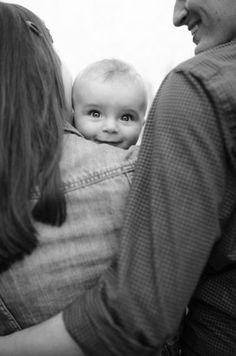 a woman holding a baby in her arms