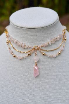 One of a kind Rose Quartz choker necklace. Made with 14k gold elements that will last. Message me for custom sizing, we are size inclusive! Raw Gemstone Jewelry Necklace, Rose Quartz Choker, Fairy Choker Necklaces, Gold Wire Necklace, Jewelry Making Aesthetic, Fairy Core Necklace, Ballroom Extravaganza, Gemstone Necklace Diy, Fairycore Necklace