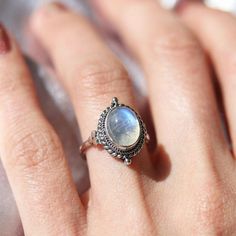 Dainty Oval Moonstone Promise Ring, Promise Oval Opal Ring In Sterling Silver, Oval Moonstone Promise Ring In Fine Jewelry Style, Oval Moonstone Crystal Ring For Anniversary, Silver Oval Cabochon Moonstone Promise Ring, Classic Oval Moonstone Jewelry, Oval Cabochon Crystal Ring With Gemstone For Promise, Oval Moonstone Promise Ring, Sterling Silver Oval Moonstone Birthstone Ring