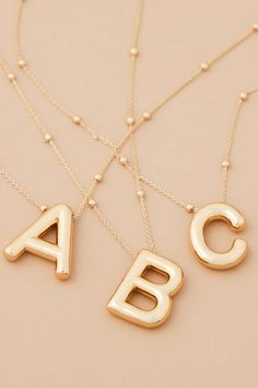 The 18K Gold Monogram Necklace gives any outfit a personal touch! With a dainty chain and initial, this will become your go-to accessory! The perfect layering piece, this necklace makes the perfect gift for friends and family. Gold Monogram Necklace, C Necklace, Monogram Necklace Gold, Cute Necklaces, Xmas List, Necklace Layered, Dainty Chain, Gold Monogram, Monogram Necklace