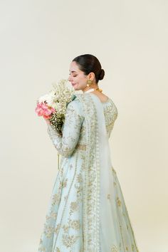 An embodiment of ethereal grace. A beautiful festive design in the captivating signature long panelled Agha Noor pishwas silhouette, crafted from pure soft organza heavily embellished with gold zardozi craftsmanship, each stitch is a testament to generations of artistry. Completing the Azeena masterpiece is a soft pure Elegant Gold Naqshi Sharara, Elegant Gold Sharara With Naqshi, Elegant Gold Sharara With Naqshi Detailing, Elegant Naqshi Lehenga For Festive Occasions, Elegant Lehenga With Naqshi For Festive Occasions, Wedding Lehenga With Naqshi Details In Georgette, Elegant Naqshi Sharara For Wedding, Bollywood Style Sharara With Naqshi For Reception, Eid Wedding Sharara With Naqshi Detail