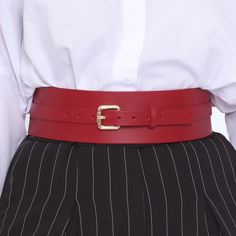 Dress up a simple outfit with this elegant and versatile wide waist belt. Fashioned in stunning smooth leather, the Athea belt adds the finishing touch to any outfit. Handcrafted in EU using Italian Full Grain Leather and Nickel Plated Hardware        It is recommended to clean the products after each wear as follows:  The leather parts should be wiped with a soft cloth, slightly damp, and let dry at room temperature the metallic elements should be well wiped with a dry cloth  It is NOT recommen Elegant Leather Belt With Self Belt, Chic Leather Belt For Office, Chic Leather Belts For Office, Classic Red Belt Buckles With Removable Belt, Chic Workwear Belts With Self Belt, Elegant Leather Corset Belt For Formal Wear, Elegant Leather Corset Belt For Formal Occasions, Elegant Belt Buckles For Workwear, Chic Evening Belt