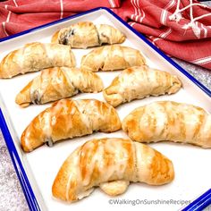 there are many croissants on the tray ready to be eaten