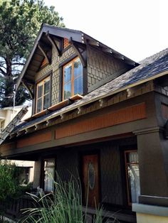 a house that is brown and has some windows