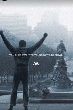 a man standing in front of a fountain with his hands up and the words you only own it to yourself to be great