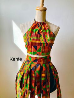 Traditional kente fringe 'skirt' or belt Ties at waist Great for African dance...wear over bloomers, bikers shorts or leggings Bloomers pictured not included Nice accessory over jeans for everyday wear Fringes range from 16 to 19 inches long and 1.5 to 2in wide Sizes: s, m, L Available in other prints African Beach Wear, African Carnival Costumes, Fitted Multicolor Skirt Set For Party, African Dance Costumes, Fitted Multicolor Skirt Set For Summer, Multicolor Fitted Skirt Set For Summer, Fitted Red Maxi Skirt For Festival, Red Fitted Maxi Skirt For Festival, Bohemian Multicolor Maxi Skirt For Party