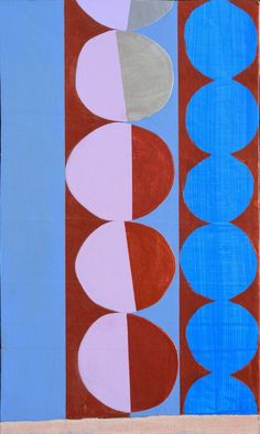 an abstract painting with blue, red and white circles in the center on a beige background