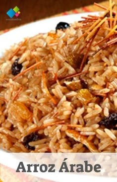 a white plate topped with rice and raisins