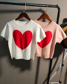 White Knitted Heart Cropped T-Shirt | Onda - Everglow Pink Fitted Heart Print Top For Valentine's Day, White Knit T-shirt Crew Neck, Red Crew Neck Top With Heart Graphic, White Knit Crew Neck T-shirt, White Crew Neck Knit T-shirt, White Tops With Heart Graphic For Valentine's Day, Pink Heart Print Stretch Top, White Short Sleeve Tops With Heart Print, Cute White Knit Top