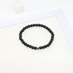 Blue Demon Eye|Evil Eye Bracelet|6MM Black Frosted Beaded Bracelet|Turkish Eye|Lucky Protection Bracelet|Men's and Women's Bracelets Listing for a bracelet   Size: Adjustable Material: Resin The blue evil eye, the Turkish eye, in the middle of the 6MM black frosted beads, more traditional protection means, adjustable design, suitable for men and women to wear, Evil Eye bracelets for lucky people  FEATURES: - Handmade with love - Blue Evil Eye bracelet. - Black Frosted Beads, Adjustable. - Tasteful for casual or formal wear. - Portable nature. - Lucky and Protection. Blue Evil Eye Bracelet, Demon Eyes, Eye Bracelets, Blue Demon, Bracelet Evil Eye, Turkish Eye, Women's Bracelets, Protection Bracelet, Blue Evil Eye