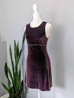 Made in the USA Are you ready to party like it's 1999? This gorgeous, purple party dress with gem beading detail is just delightful. The high neckline and stretchy velvet reminds me of Romy and Michelle's high school reunion. Buy this dress, put it on, then go watch the movie. You can thank me later. Excellent condition, no stains or damage. Tag says size M. Please remember to take your measurements. Vintage sizing may vary greatly! Chest: 32" Waist: 30" Hips: 34" Length: 33" Sweep/Hem: 42" Purple Velvet Dress For Party, Purple Velvet Party Dress, Purple Velvet Fitted Dress, Fitted Purple Velvet Dress, Glamorous Fitted Sleeveless Velvet Dress, Romy And Michelle, Purple Party Dress, Party Like Its 1999, Velvet Party Dress