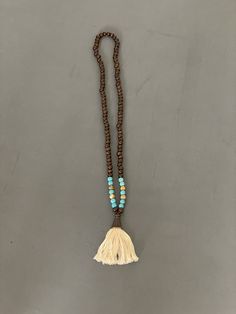 "Prayer beads, mala beads necklace | Vintage Buddha Beaded Tassle Necklace | Meditation Yoga Jewelry | Unisex  Dark wood beads mixed with turquoise dyed howlite and picture jasper beads  Off white thread set in copper  All beads are 8mm  32\" fringe pendant is 3\" long  Check out my shop for more vintage jewelry and clothing! https://sierramadrevintage.etsy.com" Bohemian Brown Mala As Gift, Bohemian Style Brown Mala For Gift, Bohemian Style Brown Mala As Gift, Bohemian Natural Jewelry With 8mm Beads, Bohemian Natural 8mm Bead Jewelry, Natural Bohemian Jewelry With 8mm Beads, Bohemian Mala With Colorful Beads For Meditation, Festival Wooden Beads In Turquoise, Bohemian Brown Beaded Necklaces With 8mm Beads