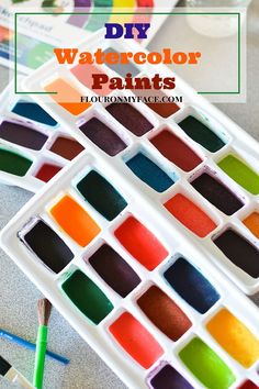 colorful watercolor paints in trays with text overlay that reads diy watercolor paints