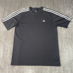 Vintage 2000s Adidas Three Stripes Soccer Casual Sportswear Athletic Y2K Aesthetic Streetwear Black Graphic Jersey Large Mens Condition:  Excellent Used Condition  = No Flaws Measurements: Please see photos above for all measurements IF YOU BUY TWO OR MORE ITEMS USE THE CODE BUNDLE @ CHECK TO SAVE 20% WE SHIP WITHIN 24 HOURS AFTER PURCHASE! Please be aware that we do not offer free returns!! The Buyer is responsible for the cost of the return label. Follow us on TikTok & Instagram @findsnostalgi Sporty T-shirt With Three Stripes For Sports, Sportswear T-shirt With Three Stripes For Workout, Three Stripes Crew Neck Activewear For Sports Season, Athletic Fit Three-stripe Activewear For Sports Events, Black Athleisure T-shirt For Sports, Sporty Workout T-shirt With Three Stripes, Gray Technical Activewear For Streetwear, Casual Adidas Logo Tops For Training, Casual Adidas Tops For Training