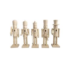 five wooden toy soldiers standing next to each other