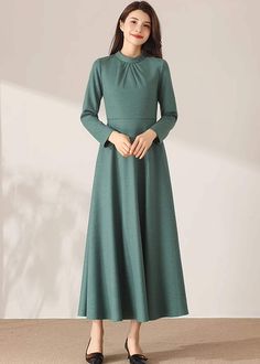 "★★ FEATURES * 30% wool, other fiber, nylon * Polyester lining * Two side pockets * Back zipper closure * Long sleeves * Fitted waist dress * Midi wool dress * Winter wool dress * Perfect for Winter, autumn * Dry clean ★★ The model is 170 cm (5′ 7″) tall with a 80 cm (31.5\") bust, 66 cm (26\") waist. She is wearing the wool dress in size XS. ★★ Bespoke Order Service If you Request other color Request the length Request a sleeve Your height is not between 155 cm- 172 cm Your weight is over 75 kg Winter A-line Maxi Dress, Wool Party Dress For Fall, Fall Party Wool Dress, Winter Maxi Dress In Solid Color, Solid High Neck Dress For Winter, Green High Neck Winter Dress, Fitted Wool Dress With Long Sleeves, Fitted Wool Long Sleeve Dress, Modest Solid Color Winter Dress