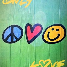 an image of peace and love painted on wood